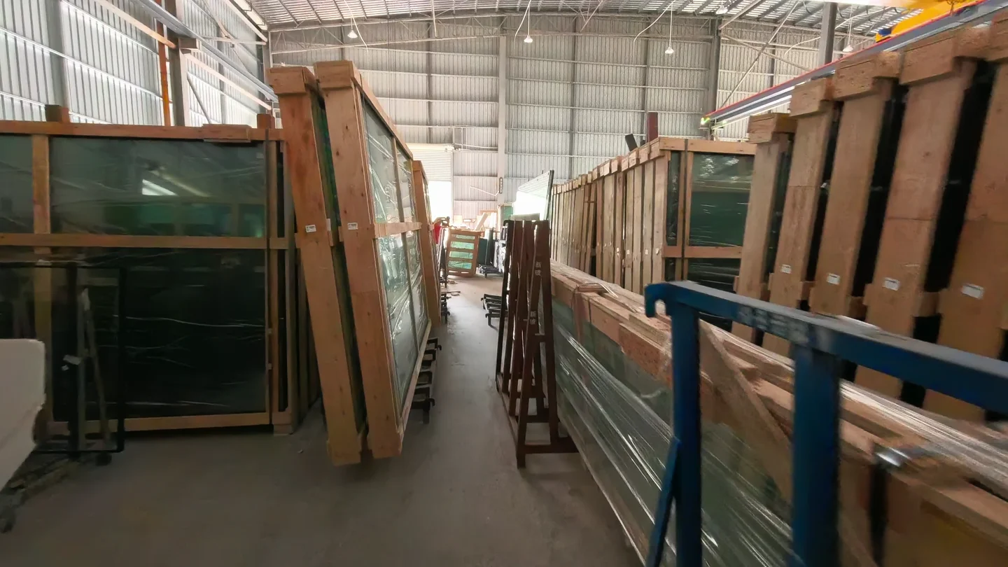 Glass panels on racks and in timber packing